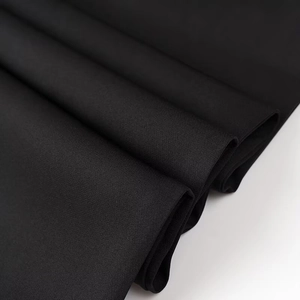 Macro view of premium black fabric texture and material thickness for two-piece suit