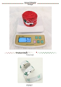 Close-up of 5cm faux burlap Christmas ribbon rolls with Merry Christmas print and snowmen