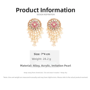 Detailed view of bohemian gold earrings with pink hearts and faux pearls showing size 7x4cm