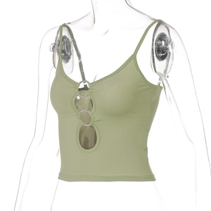 Detail of green crop top featuring a front cutout and a central metal ring connector