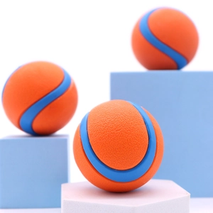 Detailed view of textured orange and blue rubber pet massage balls on display stands