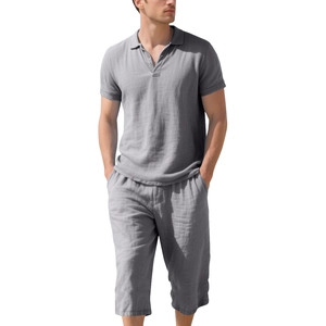 Detail of grey linen polo shirt and drawstring shorts set with breathable texture