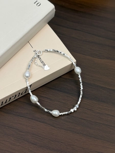 Detail of S925 sterling silver beaded bracelet with natural freshwater pearls and silver beads