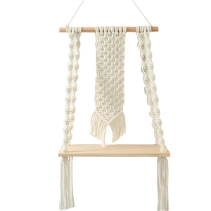 Detail of bohemian hand-woven cotton rope knots and natural wood shelf texture