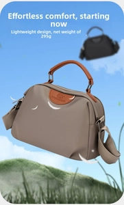 Detail showing the lightweight 295g khaki oxford handbag with brown leather handles