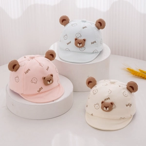 Cute baby sun hats with bear ears in pink, blue, and white soft cotton fabric