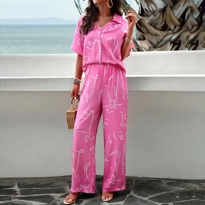 Pink printed two-piece casual set featuring short sleeve shirt and wide pants for women