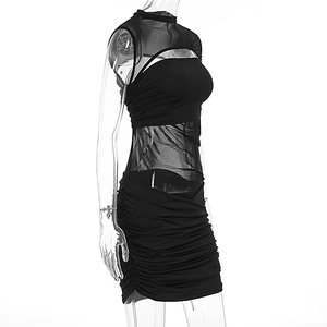 Detail of ruched bodycon mini dress with sheer mesh panels and cut-out neckline