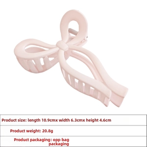 Pink bow hair claw clip showing dimensions 10.9cm x 6.3cm with matte finish details