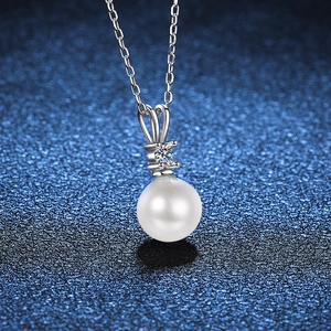 Elegant sterling silver necklace with a round white pearl and a sparkling moissanite stone
