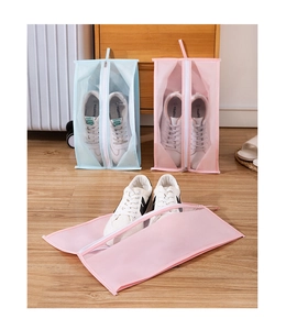 Detail of light blue and pink waterproof shoe bags with sturdy zippers and handles