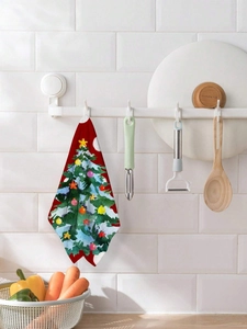 Close-up of a festive red Christmas microfiber dish towel with a snowy tree design