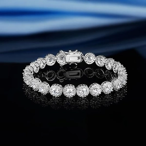 Close-up of 5mm tennis bracelet with box clasp and secure safety latches on black surface
