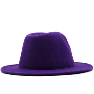 Detail shot of a premium deep purple wool fedora hat with flat brim and smooth felt texture