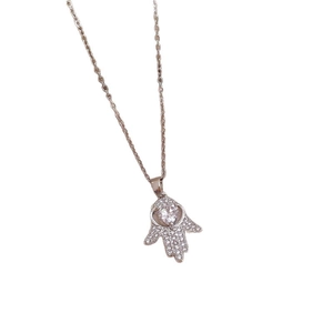 Sparkling silver Hamsa Hand necklace with paved cubic zirconia and a round central stone