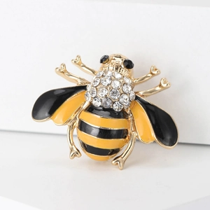 Macro shot of bee brooch with yellow black enamel and sparkling crystal rhinestones