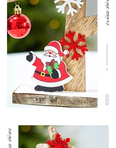 Close-up of wooden Santa ornament with red snowflake and shiny ball on natural bark base