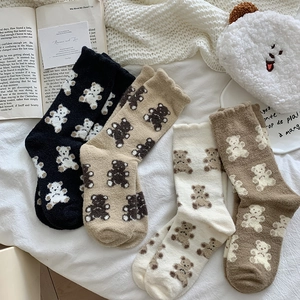 Cozy coral fleece crew socks featuring cute bear patterns in four warm autumn colors