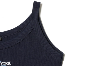 Detail of navy blue ribbed knit tank top strap and YORK letter print on the neckline