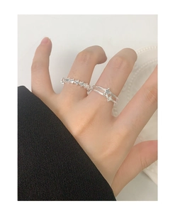 Close-up of double-layer S925 sterling silver star rings with zircon inlay for women
