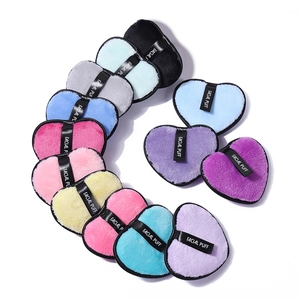 Colorful heart-shaped microfiber facial puffs with black branded straps for daily cleansing
