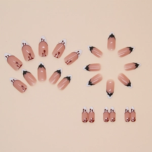 Faux ongles Halloween en amande avec motifs gouttes de sang et chauves-souris