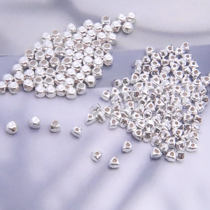S925 sterling silver geometric beads with round and heart shapes on purple silk