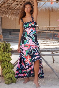 Detail of tropical floral print maxi dress featuring high waist and wavy hemline