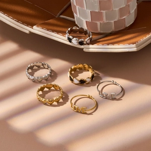 French retro titanium heart and enamel rings set in gold and silver finish