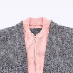 Women's fuzzy grey knit jacket with pink ribbed inner zip collar detailing