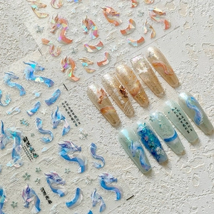 Detail of M-295 5D dragon nail stickers with laser holographic texture and golden hues