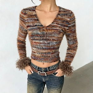 Detail of multi-color V-neck cropped knit top with faux fur cuffs and fuzzy texture