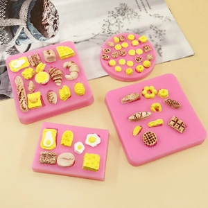 Detail of pink silicone molds for making mini waffles, croissants, and donuts