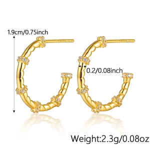 Detailed view of twisted gold silver hoop earrings with cubic zirconia and dimensions