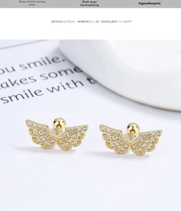 Detail of 925 sterling silver wing earrings with white zircons and screw ball backs