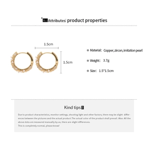 Detail view of gold circular earrings with zircon and pearls showing size 1.5cm by 1.5cm