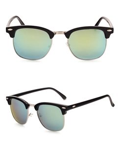 Detail of vintage semi-rimless sunglasses with silver metal frame and green gradient lenses