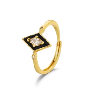 Vintage geometric gold ring with black rhombus base and crystal center stone