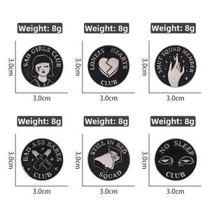 Detailed view of six dark punk enamel pins with black silver geometric flame designs