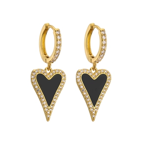 Macro view of heart-shaped gold earrings with black enamel and micro-pave cubic zirconia