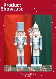 Close-up of sky blue nutcracker figurines with silver glitter and holiday drum