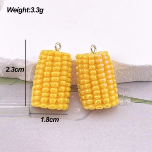 Macro shot of corn-shaped charms showing 2.3cm height and 3.3g weight for DIY jewelry