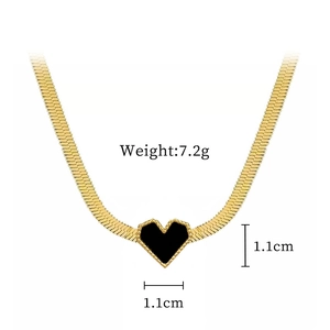 Detail of gold snake chain with a black heart pendant, 1.1cm size and 7.2g weight
