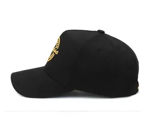 Side view of black five-panel baseball cap with detailed gold embroidery on crown