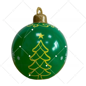 Detail of green inflatable Christmas ball with gold trees and snowflakes holiday decor
