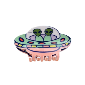 Cartoon UFO alien hair claw clip in green and pink acrylic for a sci-fi dopamine style