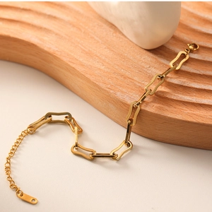 Detail of 18k gold plated stainless steel geometric chain bracelet with lobster clasp