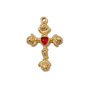 Detailed view of golden cross pendant featuring red heart gem and rose petal relief