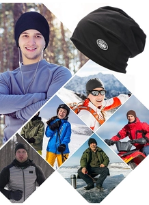 Detail of black knit beanie featuring lifestyle scenes like skiing and outdoor winter sports