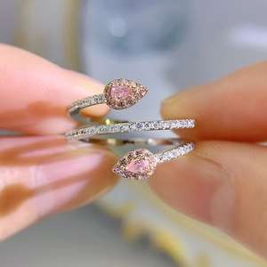 Detailed close-up of 925 silver snake ring featuring pink carbon diamonds on hand